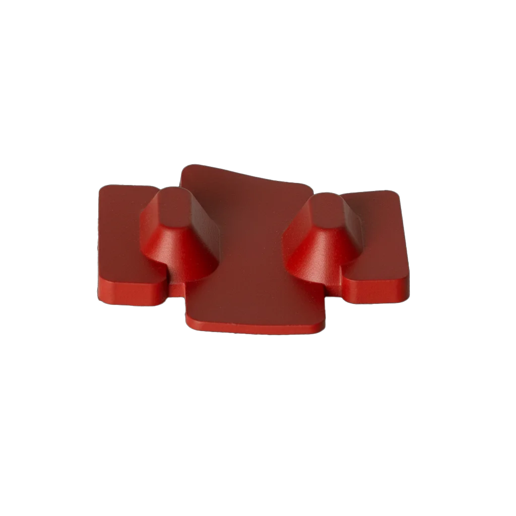 Red custom molded rubber component with raised features